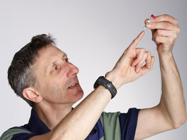 Molecular Biologist Nick Goldman Holds a Vial of DNA Used to Encode Written, Audio, and Visual Data