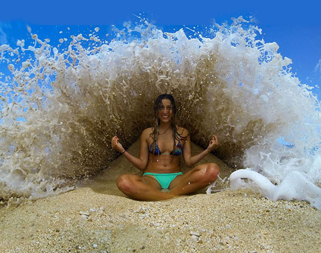 Carefully-Shaped Sand Pile Behind Her